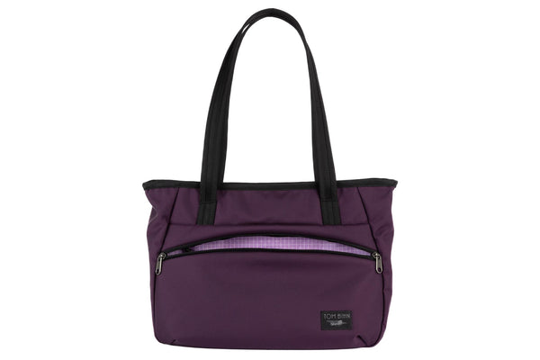 Photo of the Nomad Tote in Aubergine Ballistic with Wisteria (pale purple) 200 Halcyon interior.
